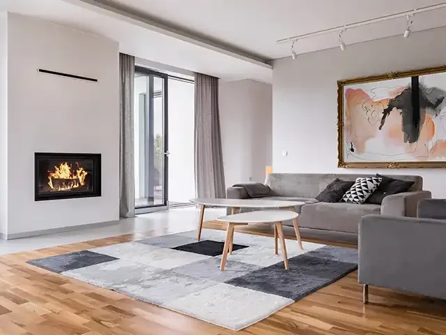 areas served - modern living room with fireplace, sofa, balcony and pattern carpet photo