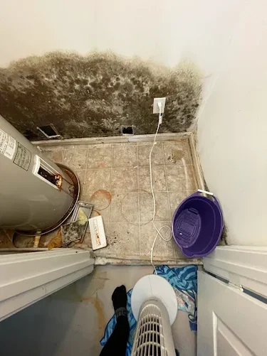 water damage behind a water heater